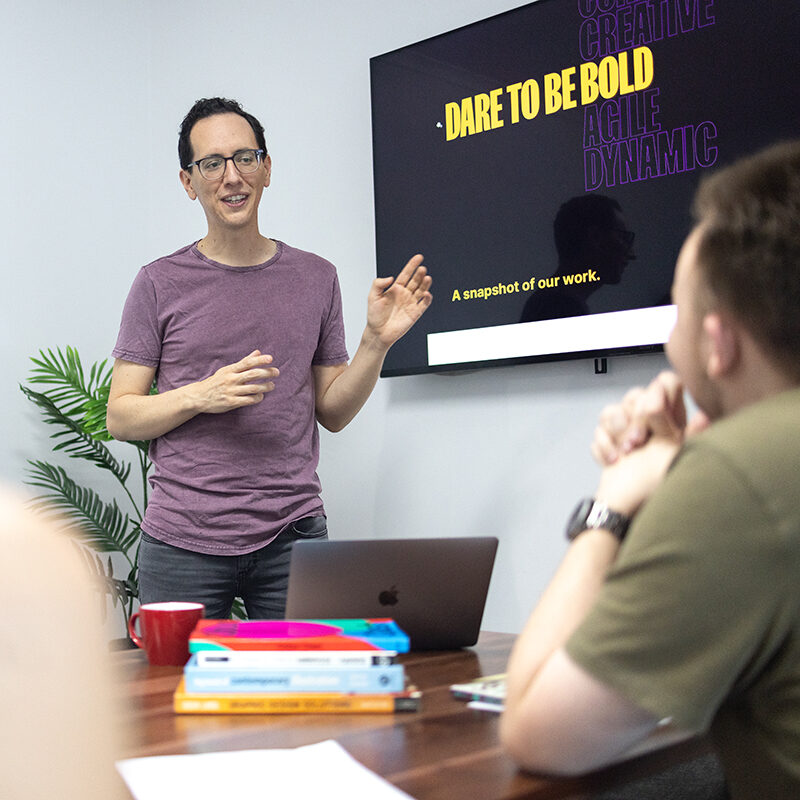 086A1337-marketingstrategy Juan and Callum reviewing website design in Cairns office